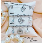 #H Pulseras Rígidas Con Dijes 