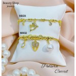 #H Pulseras Rígidas Con Dijes 
