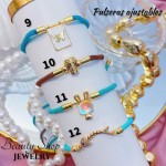 pulsera hilo color con dijes 12.5&