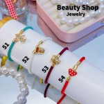 Pulsera ajustable color y dijes 10&