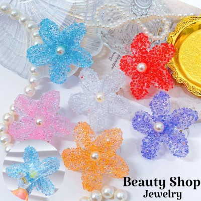 pinza hawaina con gota de agua