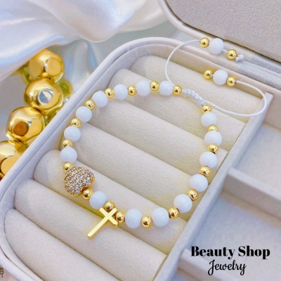 pulsera ajustable con dije corazon y cruz 14.50&
