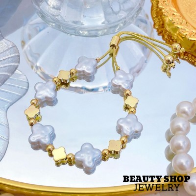 pulsera perla con figura oro chino