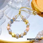 pulsera perla con figura oro chino
