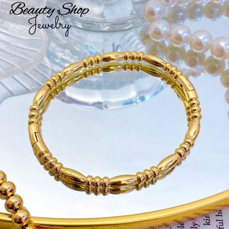 pulsera rigida oro chino 16&
