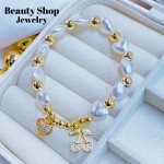 pulsera perla con balin cereza oro chino