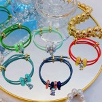 pulsera ajustable con charms 15&