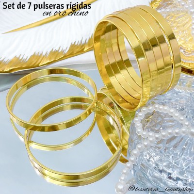 Set de 7 pulseras rígidas en oro chino