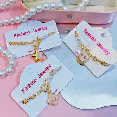 pulsera eslabon con dije y perlas 11&